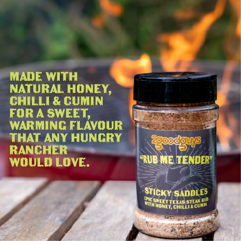 2GoodGuys Rub Me Tender Sticky Saddles BBQ Rub with a BBQ.
