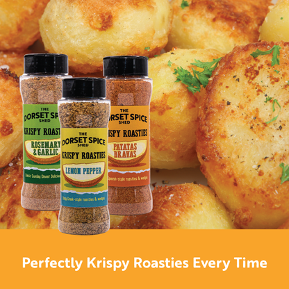 Three jars of Dorset Spice Shed Krispy Roastie Seasoning labels and roasted potatoes on a yellow background.